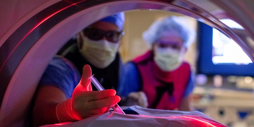 Interventional radiology residents working together in the lab.