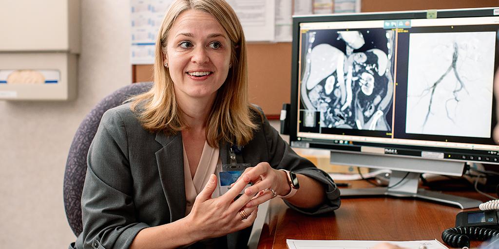 Interventional radiology resident explaining a scan to a patient at Mayo Clinic in Rochester, Minnesota.