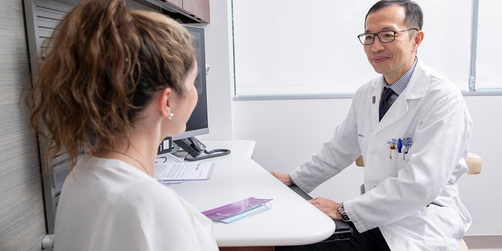 Dr. Dinh meets with a patient in a clinic room at Mayo Clinic in Jacksonville, Florida.