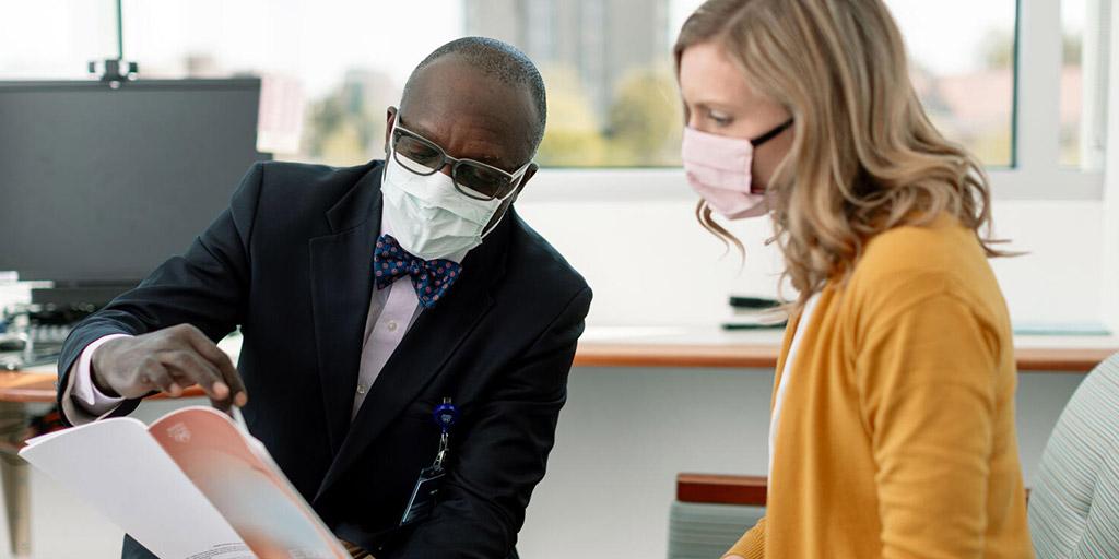 Dr. Famuyide speaks with a patient at Mayo Clinic in Rochester, Minnesota.