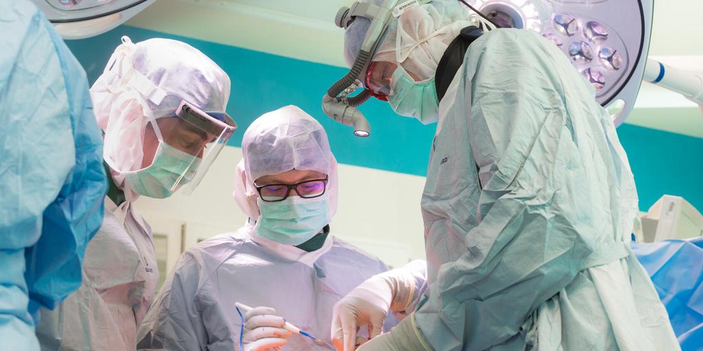 Dr. Matthew Houdek from Musculoskeletal Oncology Fellowship in Rochester, Minnesota, performs a procedure in an operating room.