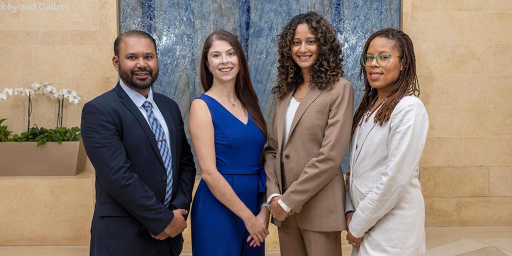 Four nephrology fellows pose together.