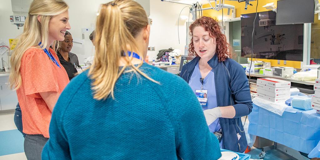 Five people from the Neurocritical Care Fellowship program in Jacksonville, Florida, participated in a workshop in a simulation center.