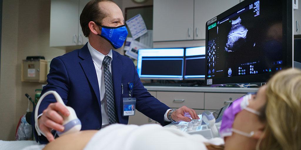 Obstetrics faculty Carl Rose, M.D. performs an ultrasound