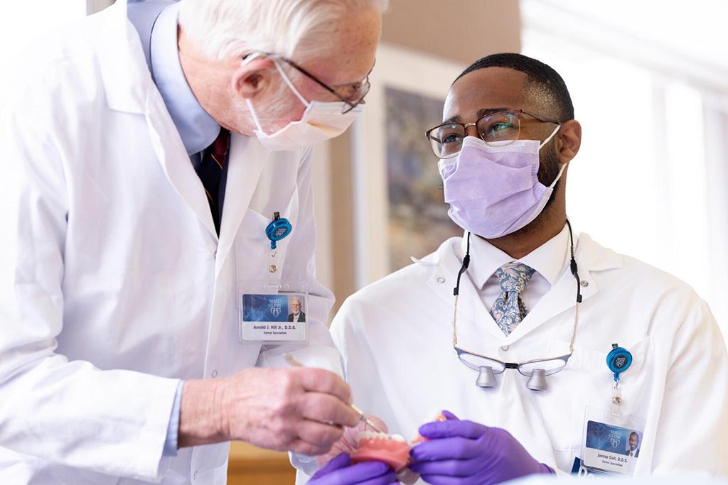 Two people from the Orthodontics Residency at Mayo Clinic in Rochester, Minnesota, discussed a model of a mouth.
