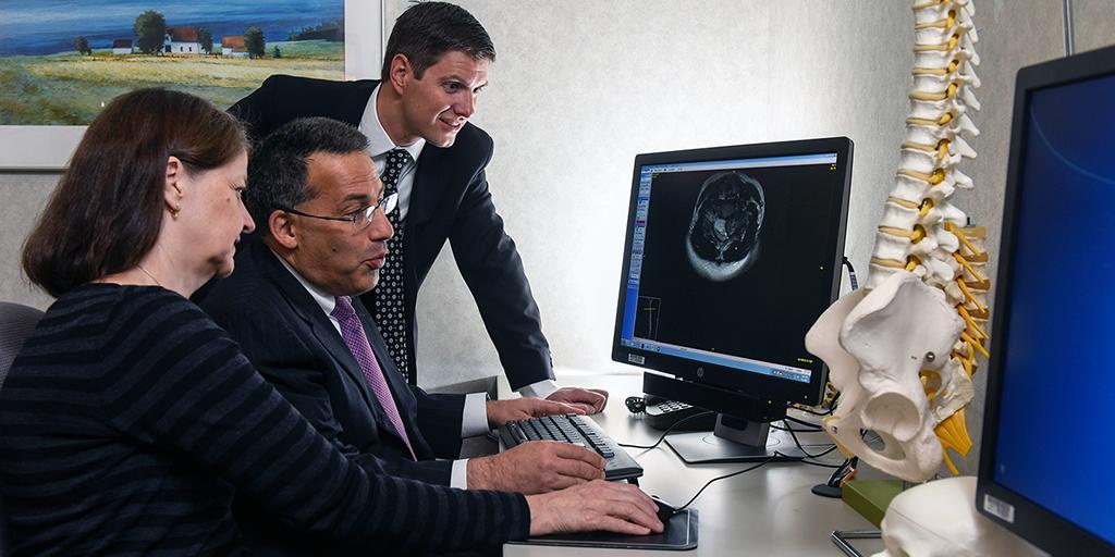 Orthopedic sports medicine surgeons look at images