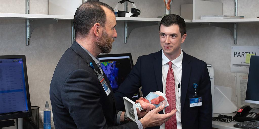 Mayo Clinic otolaryngology faculty member with a resident