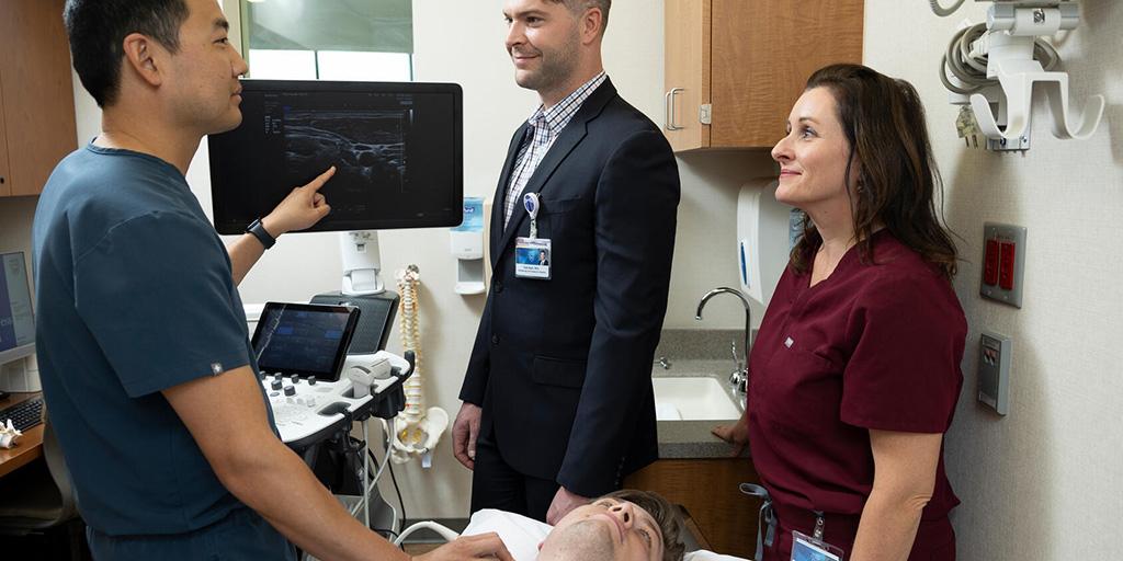 Pain Medicine Staff Performing Ultrasound On Patient