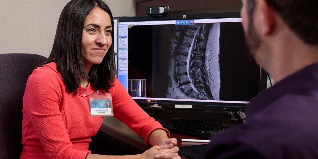 Pain medicine fellow seeing a patient