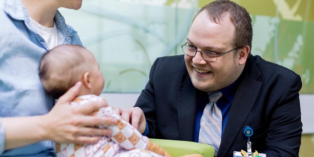 Doctor examining baby