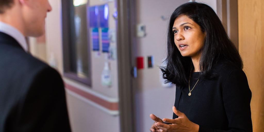 Plastic surgery faculty discuss a case.