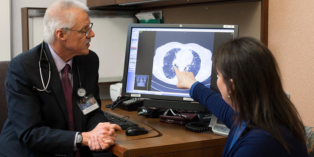 Pulmonary Hypertension fellow speaks with a patient. 