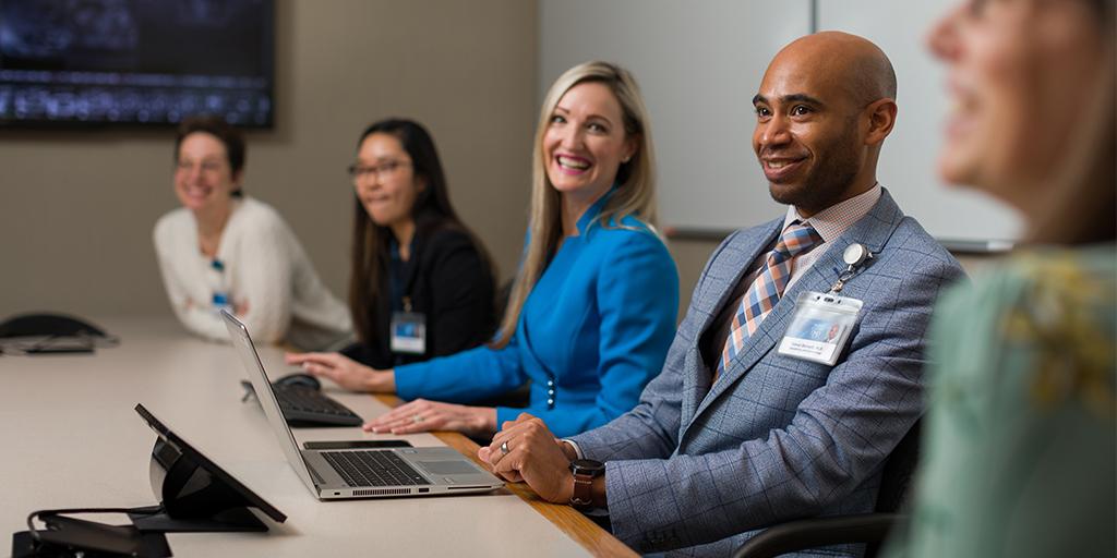 Reproductive Endocrinology and Infertility fellows in a conference