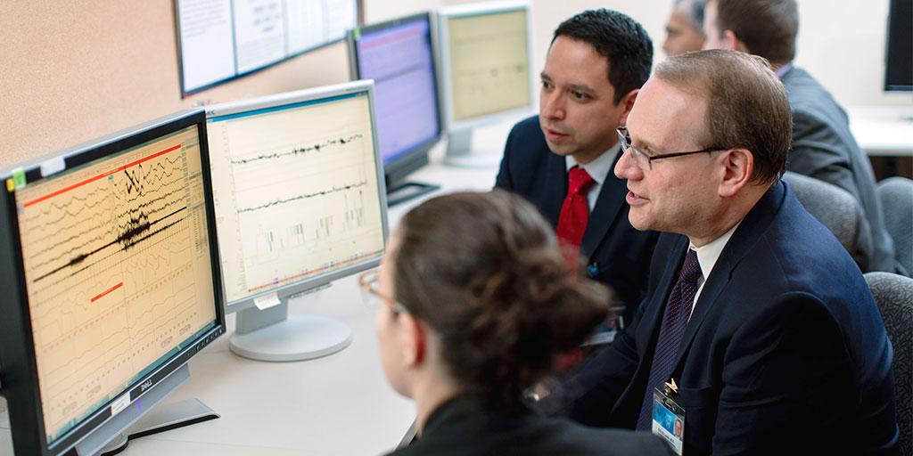 Mayo Clinic faculty member reviewing test results with two trainees