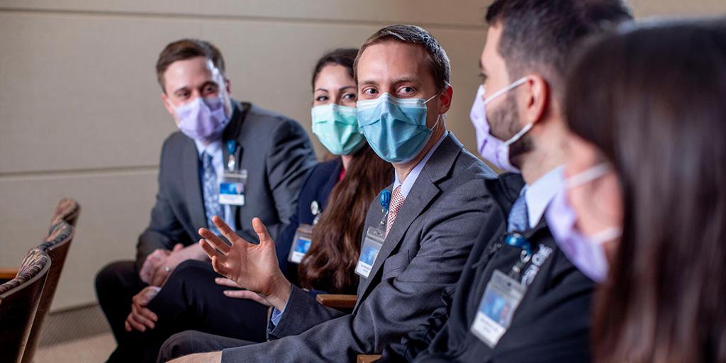 Five fellows at Mayo Clinic's Rheumatology Fellowship program in Rochester, Minnesota, have a discussion.