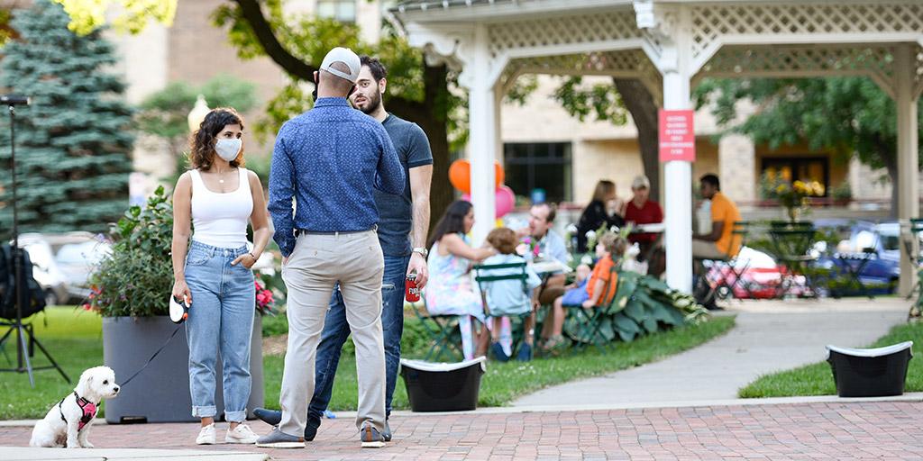 Spine Surgery Fellowship graduates hanging out at a park at the 2020 graduation ceremony.
