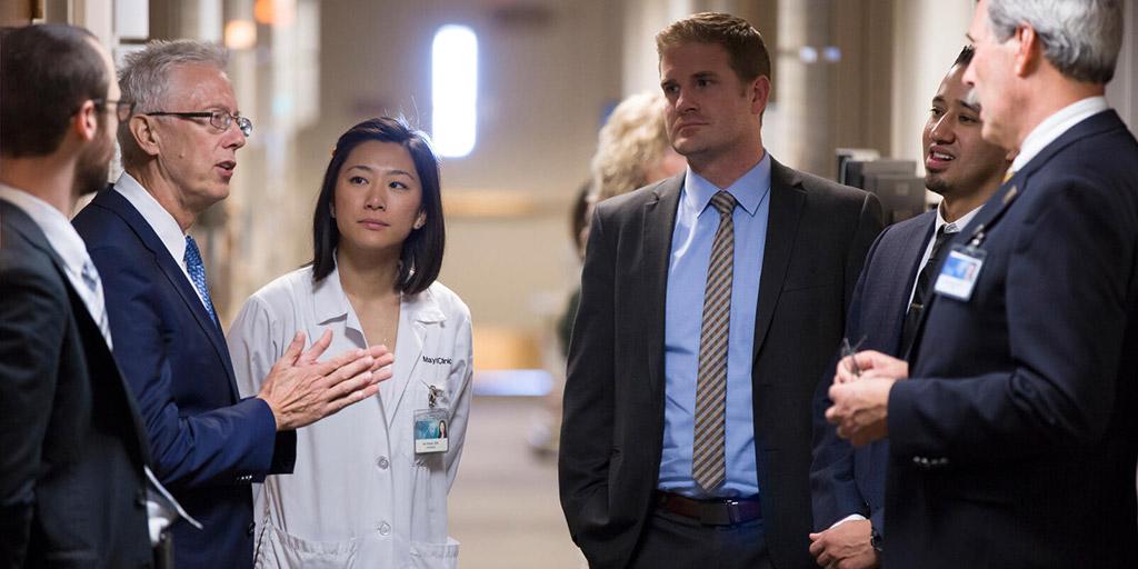 Dermatology fellows and faculty having a consultation in the hall at Mayo Clinic in Phoenix, Arizona.