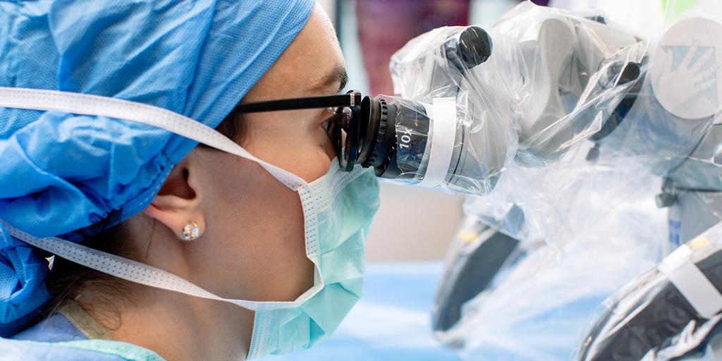 Trauma and Genitourinary Reconstruction Fellowship doctor performing surgery in an operating room.