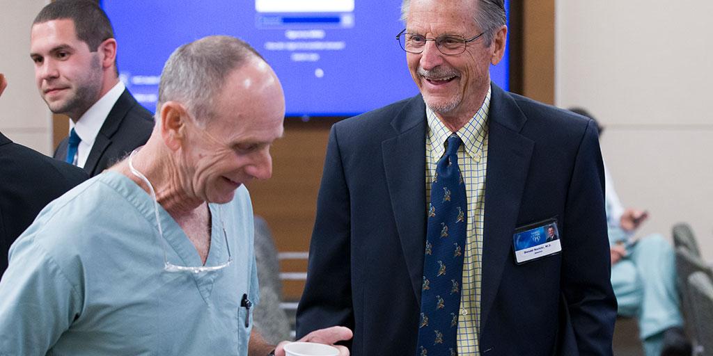 Mayo Clinic urologists chat at an event in Arizona.