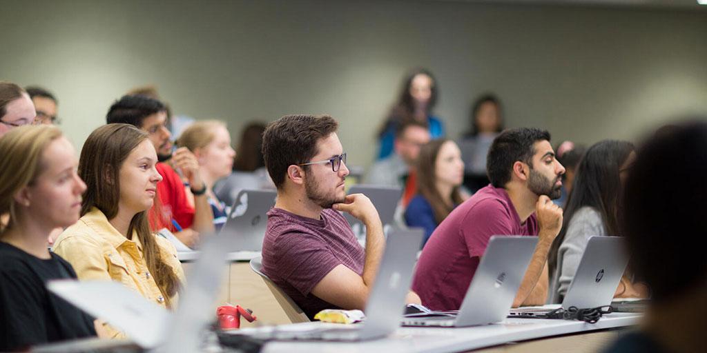 Students sitting in a lecture hall during didactic education