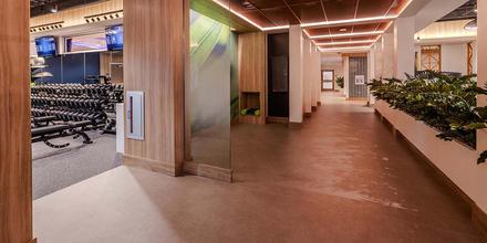 The free weights and stretching areas are shown in the Bill Hewitt Employee Wellness Center.