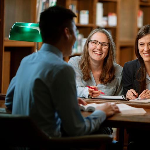 Three medical students at Mayo Clinic Alix School of Medicine study together in the library on the Mayo Clinic campus in Rochester, Minnesota.