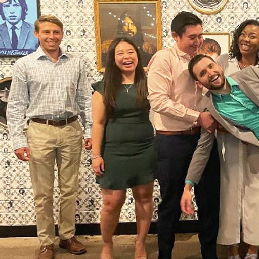 Residents from Mayo Clinic's Internal Medicine Residency program in Arizona being playful and carrying a fellow resident.