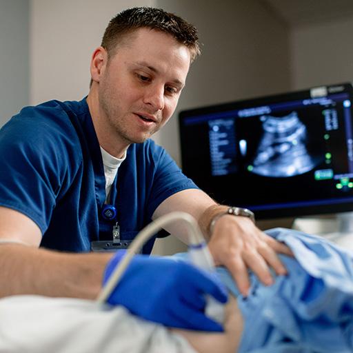 A person using a machine to help a patient.
