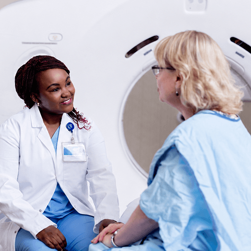 Fellow speaking to patient before scan