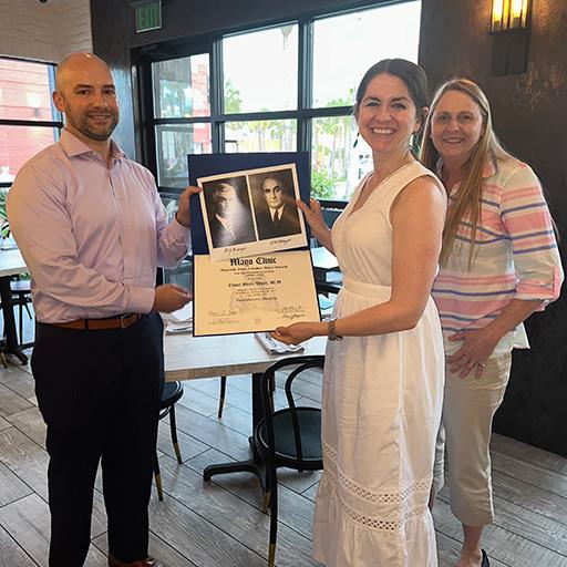 Associate Program Director, Justin Stowell, M.D. and Program Director, Patricia Mergo, M.D. presented our 2023 fellow graduate, Chanel Wood, M.D. with the diploma.