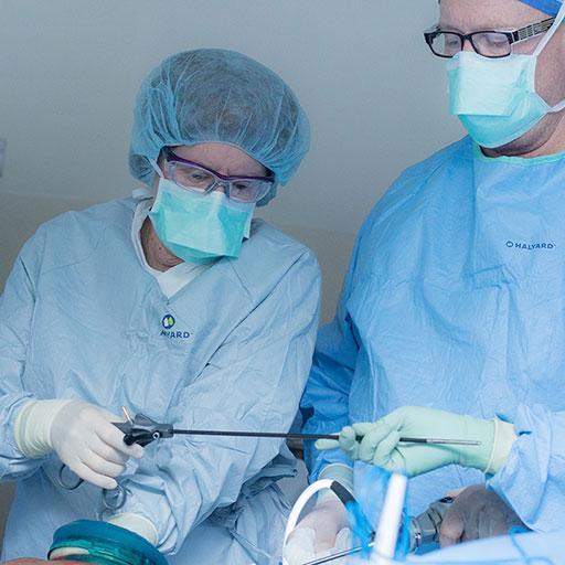 Physicians in the operating room performing a colon and rectal surgery