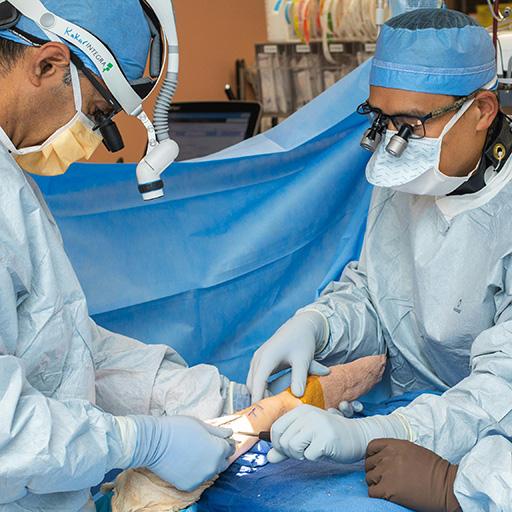 Dr. Sanj Kakar with fellow and resident in operating room scenario