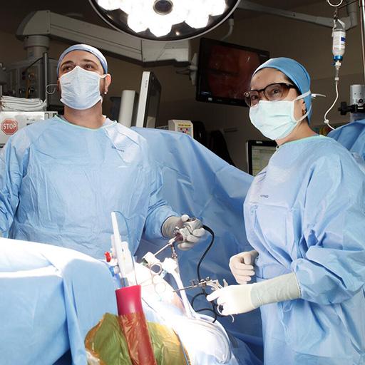 Two fellows performing surgery