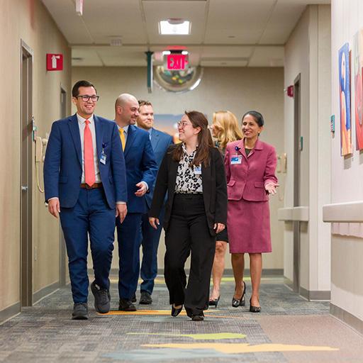 Nephrology faculty walk together in a hallway.