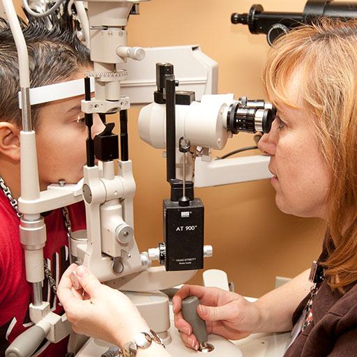 A fellow in the pediatric ophthalmology and strabismus fellowship works with a pediatric patient at Mayo Clinic in Rochester, Minnesota.