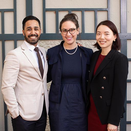 Three fellows pose for a group photo.