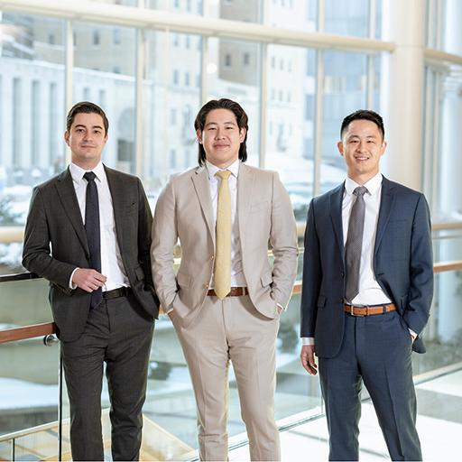 Three fellows pose for a group photo.