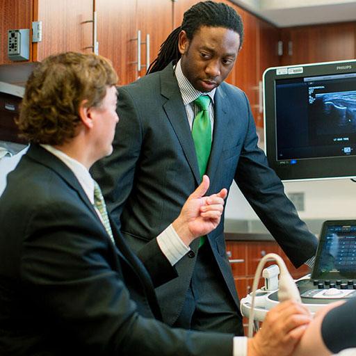 Mayo Clinic physical medicine and rehabilitation (PM&R) resident conducting an ultrasound with a faculty member