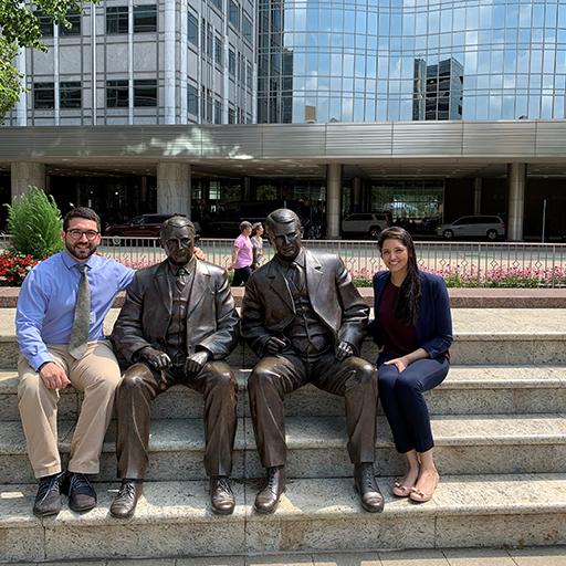 Spine Surgery Fellows with the Mayo brothers statues at Mayo Clinic in Rochester, Minnesota.