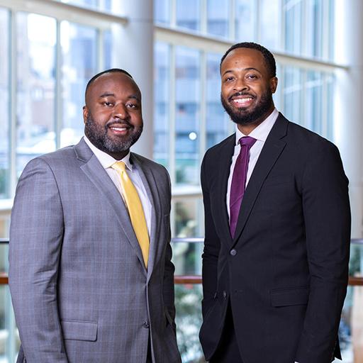 Two current fellows in the program pose for a photo