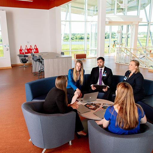 Mayo Clinic staff talking around a table