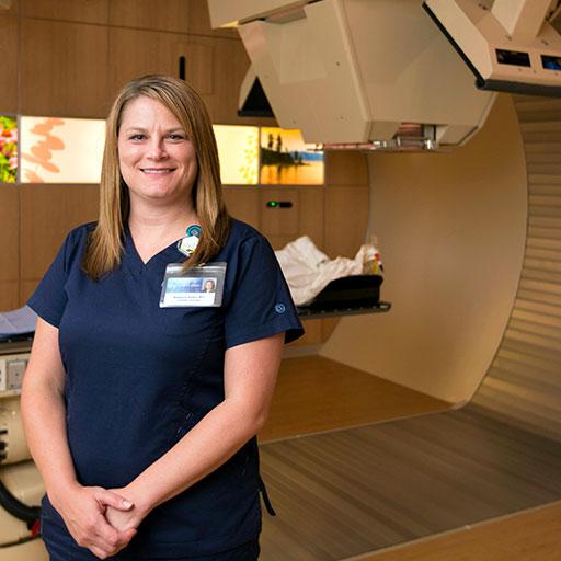 Mayo Clinic radiation therapist standing in procedure room