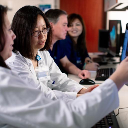 Advanced cardiovascular sonographers reading a patient's results