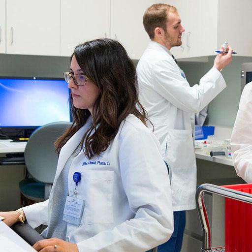 Three pharmacy residents working in an office together