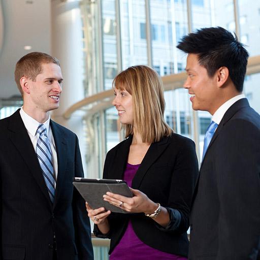 Mayo Clinic pharmacist and pharmacy residents talking in hallway