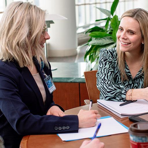 Social workers discussing cases in a multidisciplinary setting.