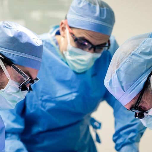 Three fellows from abdominal transplant and hepatopancreatobiliary surgery mn performing surgery