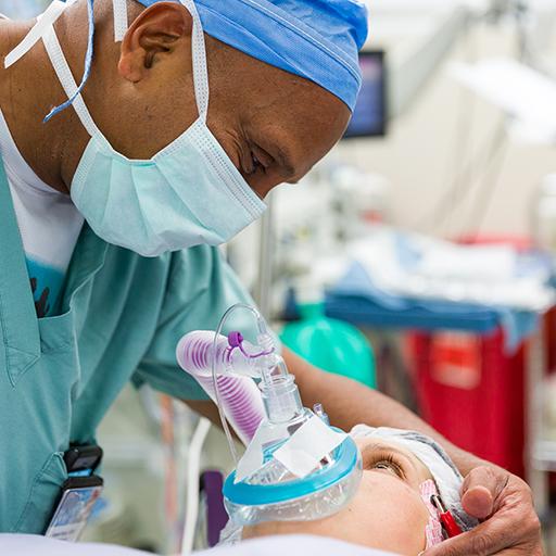 Abdominal transplant anesthesiologist reassures patient.