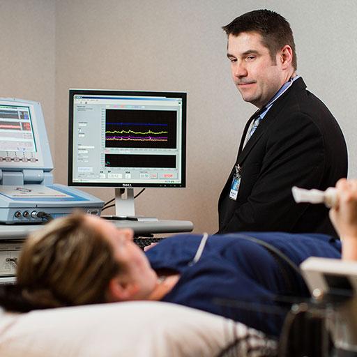 Physician performing a test on a patient with an autonomic disorder