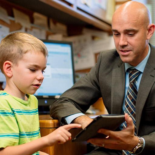 Stephen Whiteside, Ph.D., L.P., works with a young patient at Mayo Clinic in Rochester, Minnesota.